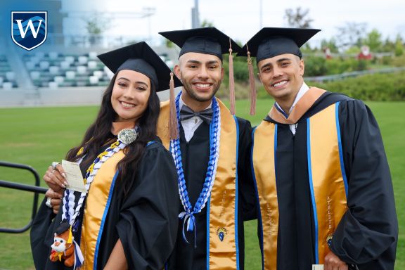 Smiling students in graduation regalia, Westcliff University Commencement 2024