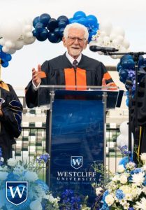 Marty Cooper giving a speech at Westcliff University's Commencement Ceremony, 2024