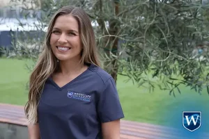 nursing student smiling on campus