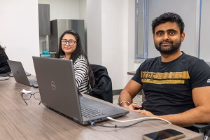 Westcliff University - Dallas campus - students on laptops at desk